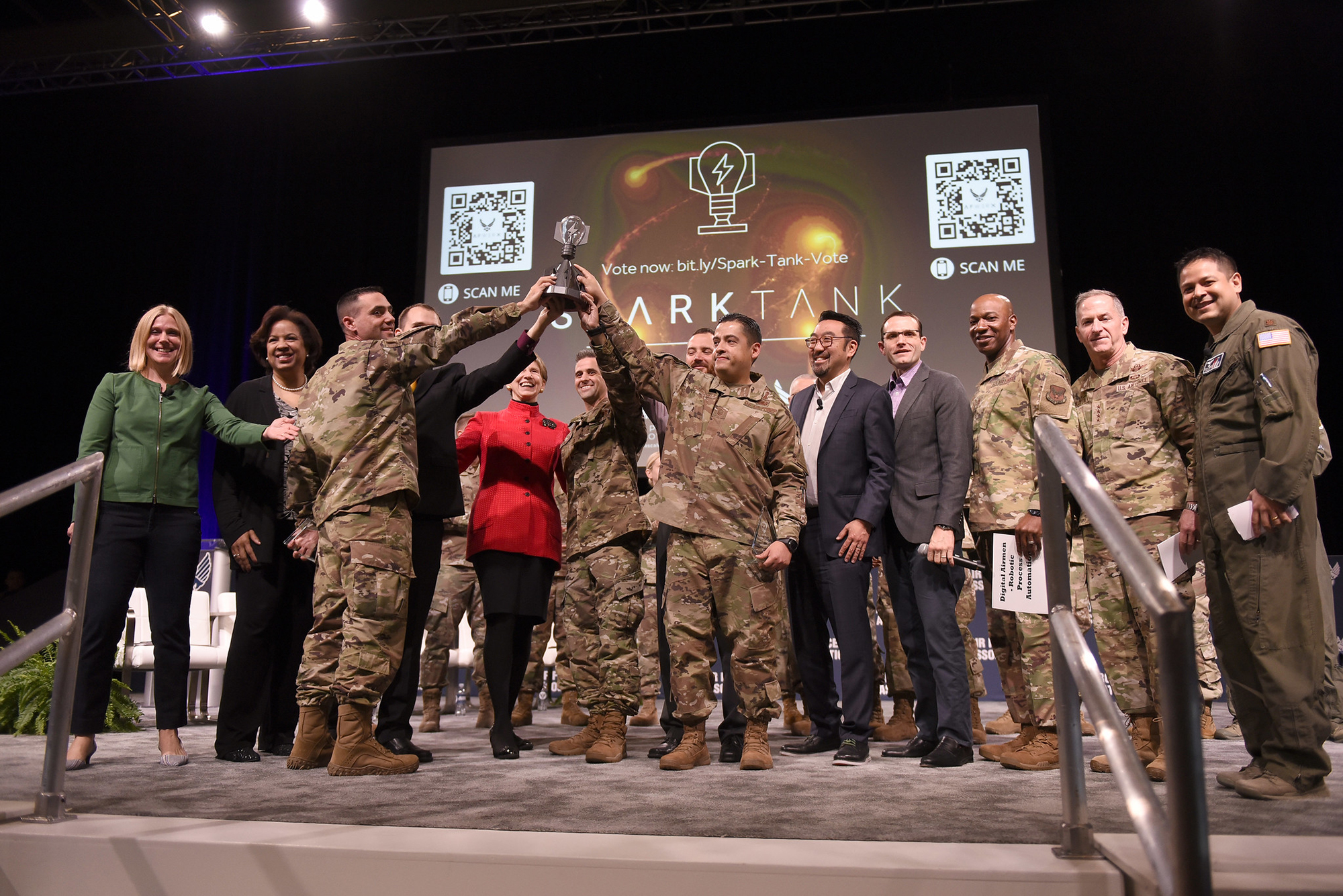 Air Force leaders and innovators on stage together at a Spark Tank showcase