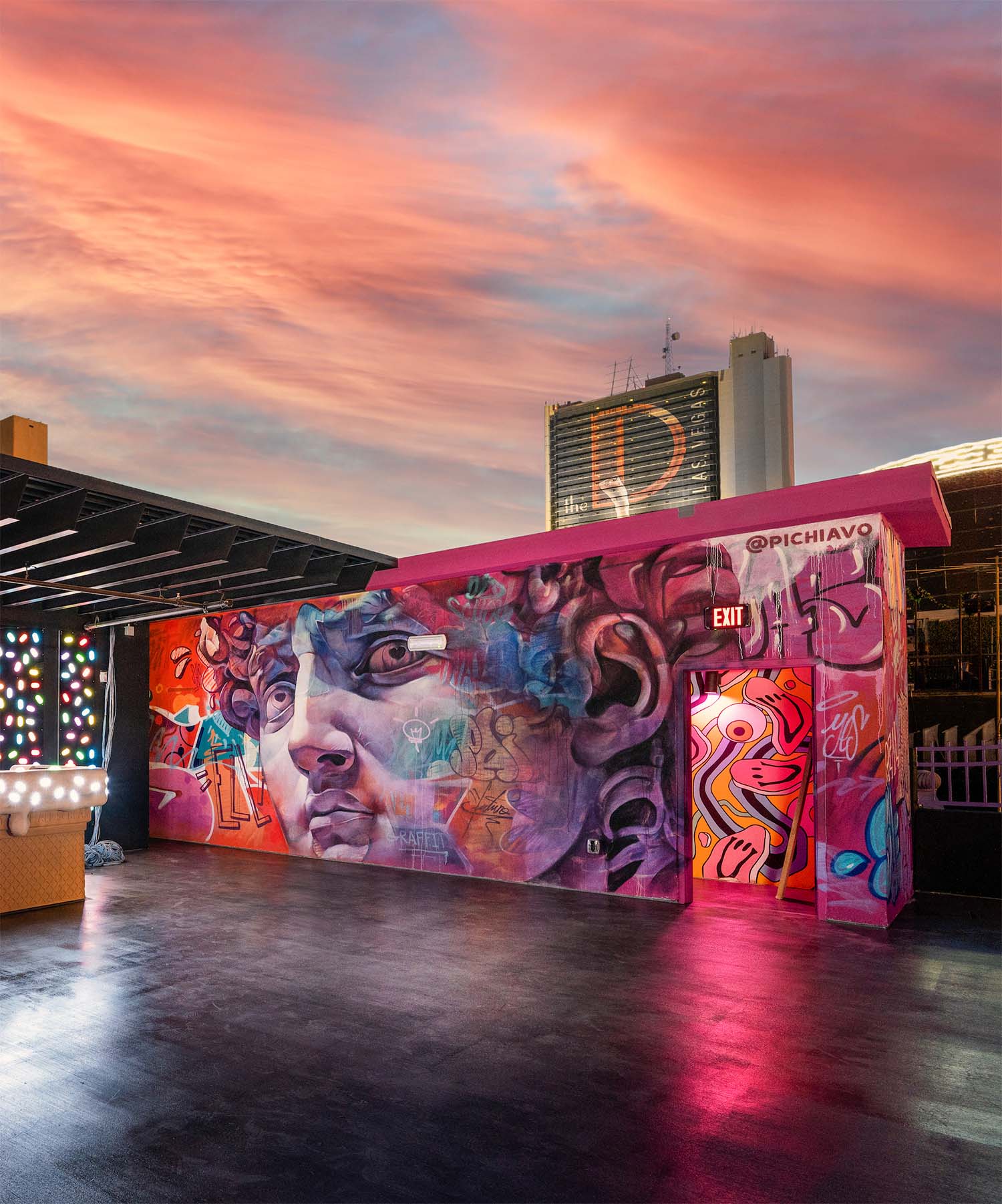 Street-art mural on a Downtown Las Vegas rooftop at sunset
