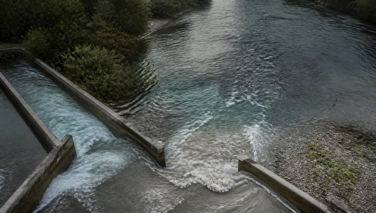 High angle view of two water channels converging into a single stronger flow.